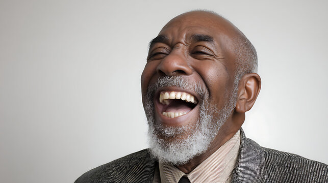 The Joy of Laughter:  A close-up portrait of an elderly man with a full, white beard and a joyous expression. His genuine laughter radiates positivity, embodying the simple beauty of joy.