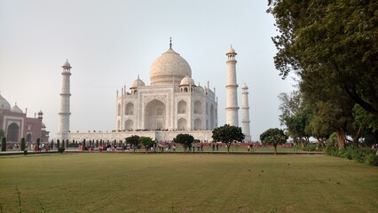 Taj mahal monument with visitors