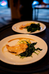 Plated chicken dinner served at formal event reception