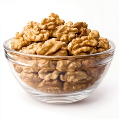 Fototapeta premium Walnut kernels in glass bowl, healthy snack isolated on white background