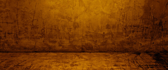 empty gold and yellow studio backdrop. well editing wall and floor concrete perspective for display product and text present. empty room with free space use as backdrop photo in panorama view.