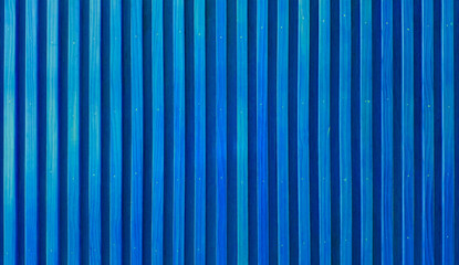 uniformly textured surface composed of numerous parallel, abstract light blue wooden slats arranged...