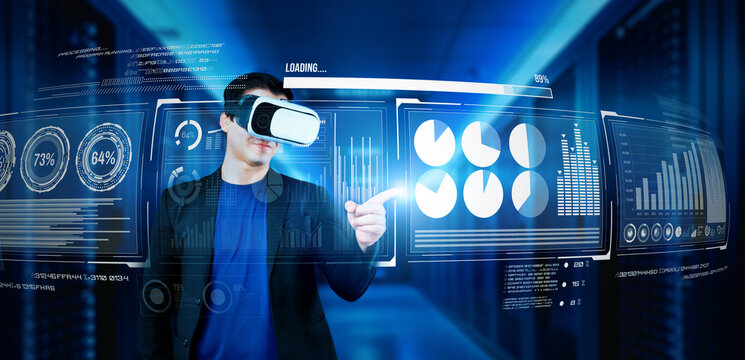 Businessman with headset standing at data center while analyzing financial data. Manager pointing marketing statistic hologram and using augmented reality goggles while making a decision. Ingenuity.