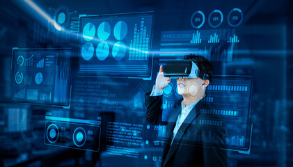 Project manager with VR goggles looking financial chart and glowing blue light at office. Skilled businessman checking and planning marketing strategy by using data from augmented reality. Ingenuity.