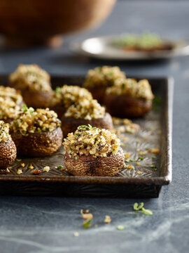 stuffed mushrooms on baking sheet