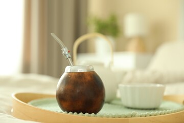 Traditional yerba mate tea on bed indoors