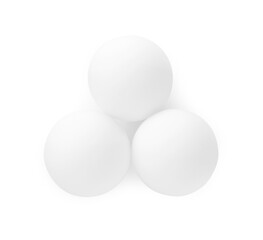 Three ping pong balls isolated on white, top view