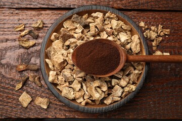 Pieces of dry chicory roots in bowl and spoon with powder on wooden table, top view