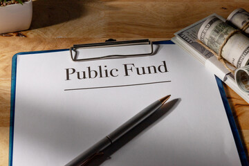 Public Fund Report with Cash Stack on Desk