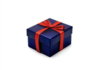 dark blue present with red ribbon adorns plain background signifying special occasion celebration