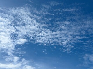 Blue sky with cirrocumulus clouds.