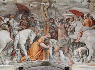 la Maddalena ai piedi della Croce; particolare dell'affresco della crocefissione del Romanino nella  chiesa di Santa Maria della Neve a Pisogne (Brescia)