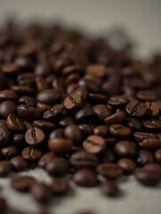 Obraz premium A close-up view of rich, dark roasted coffee beans scattered on a surface.