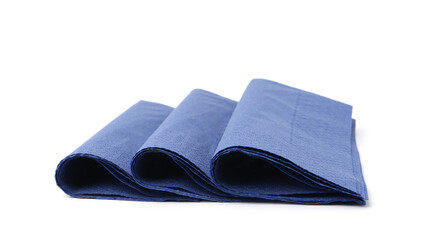 Many blue paper handkerchiefs isolated on white