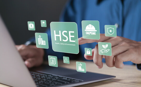 HSE, Health safety environment concept. Standard safe industrial work and industrial. Person using laptop with HSE icons on virtual screen for business and organization.