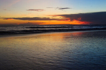 beautiful dramatic landscape of sunset on the sea beach