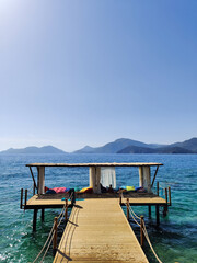 beautiful bungalows for relaxation in the middle of the water with a path from the beach