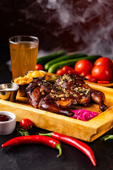Closeup of roasted grilled whole chicken served at restaurant