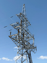 power line tower on the background of the blue sky