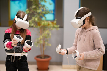 a child in virtual reality glasses plays a game
