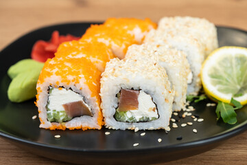 delicious traditional Japanese sushi and rolls on a plate