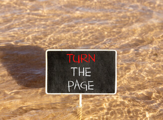 Naklejka premium Turn the page symbol. Concept words Turn the page on beautiful blackboard. Beautiful Red sea water background. Business motivational lifestyle turn the page concept. Copy space.