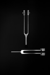 neurological hammer on a black background. medical instrument on a black background, medical equipment lies.