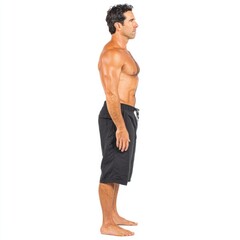 Fototapeta premium Athletic Man Posing Shirtless in Dark Shorts Bodybuilding Posture Side View Against White Background