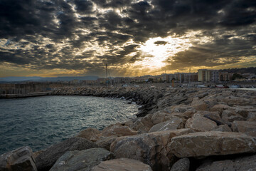 sunset on a cliff of a port
