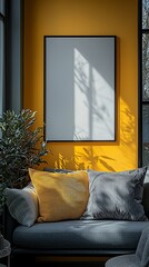 Sunlit corner with gray sofa, yellow wall, and blank frame.  Cozy and modern interior design