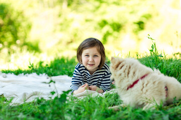 Beautiful girl with a Pomeranian dog