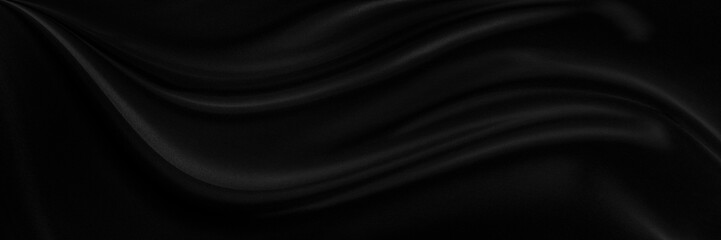 Black satin dark fabric texture luxurious shiny that is abstract silk cloth background.