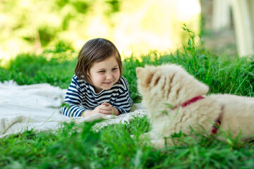 Beautiful girl with a Pomeranian dog