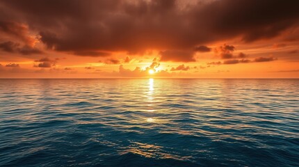 Obraz premium Majestic Ocean Sunset with Golden Sky and Calm Waves