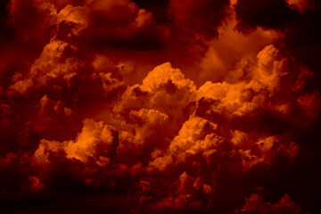 Black dark blood red fire orange yellow sky with clouds. Dramatic background. Thunderstorm storm...