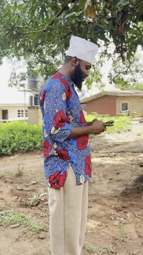 happy man looking at mobile phone