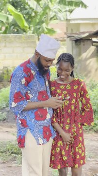 traditionally dressed african people using phone for the first time