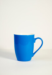 Bright Blue Ceramic Coffee Mug on Minimal White Background