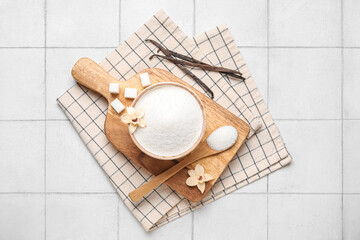 Bowl of sweet vanilla sugar on white background