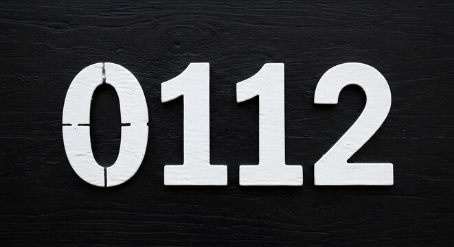 White Number 0112 on Dark Wood Background Graphic Resource