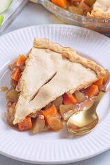 Homemade apple and sweet potato cobbler pie showing filling ingredients, vertical closeup