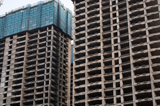 High-rise concrete structure with deep architectural shadows