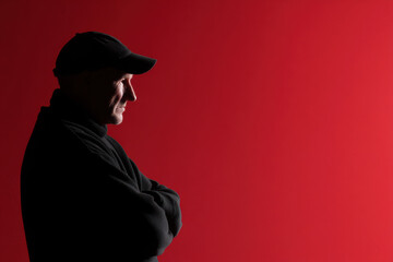 portrait of foundry worker positioned on left side of frame hands out of view displaying concentrated emotion