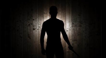 Sinister Silhouette of a Person Holding a Knife Cast Against a Weathered Wooden Plank Wall in High Contrast Chiaroscuro Isolated on White