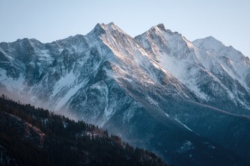Majestic snowy mountain peaks at dawn.