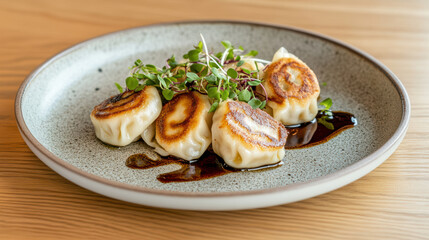 Delicious plated dumplings garnished with herbs and sauce, showcasing culinary artistry