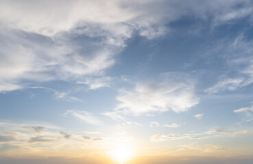 Fototapeta premium Front view and full frame of beautiful morning or evening blue and orange sky with cloudy while sunsets or sunrises taken at the sea used as natural blackground texture