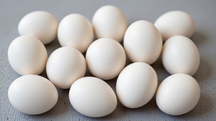 Fresh White Eggs Displayed on a Light Gray Background for Cooking and Baking Themes