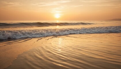 Fototapeta premium Golden sunset paints the beach and sea with orange hues as the sun dips below the horizon