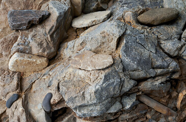 Close-up of rough stone rock surface with sharp edges